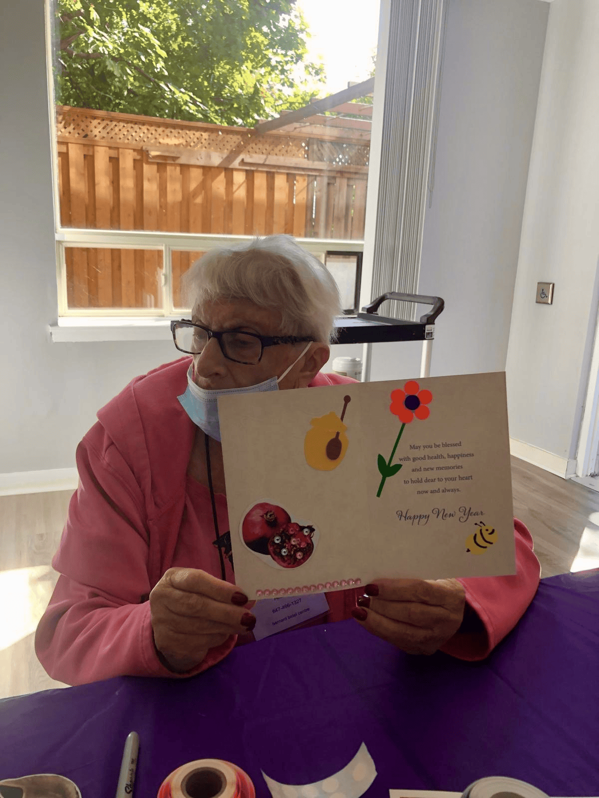 Participant holding a handmade greeting card